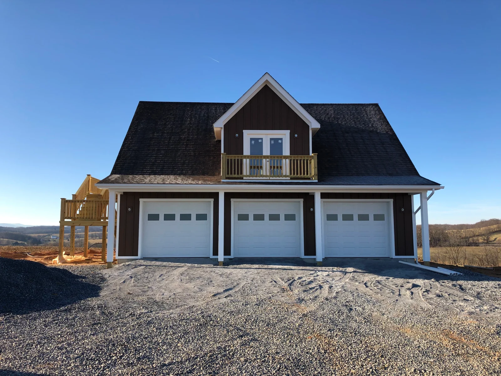 Three-door garage with a dormer above