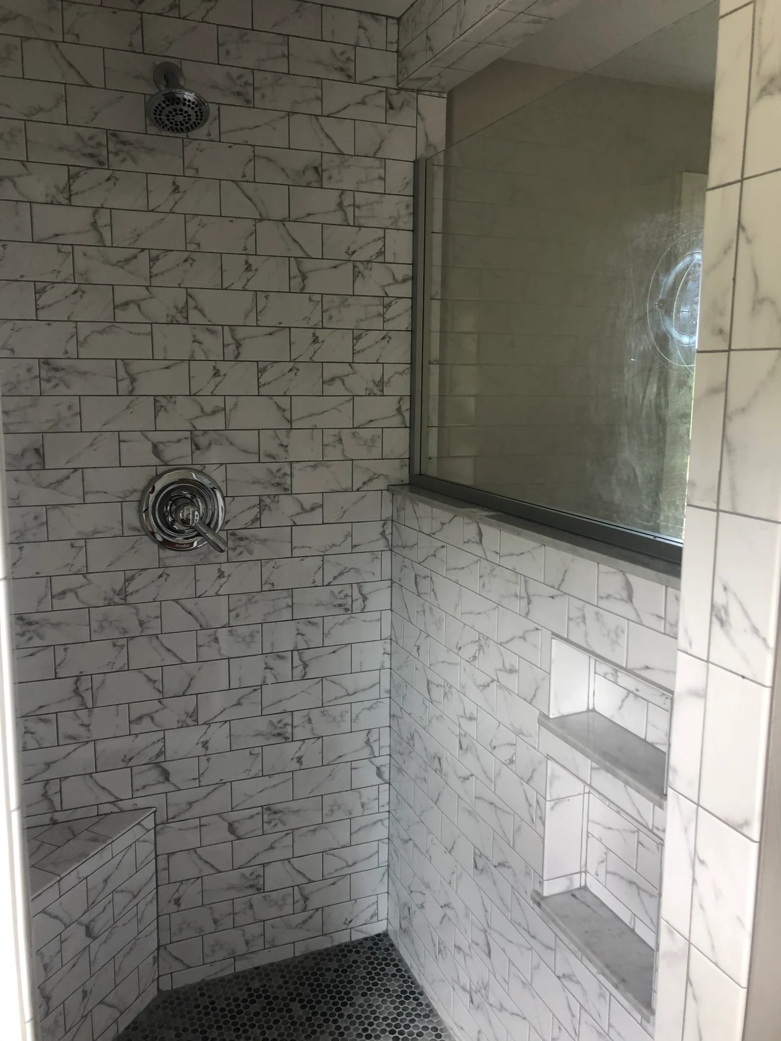 Tiled shower with built-in shelving